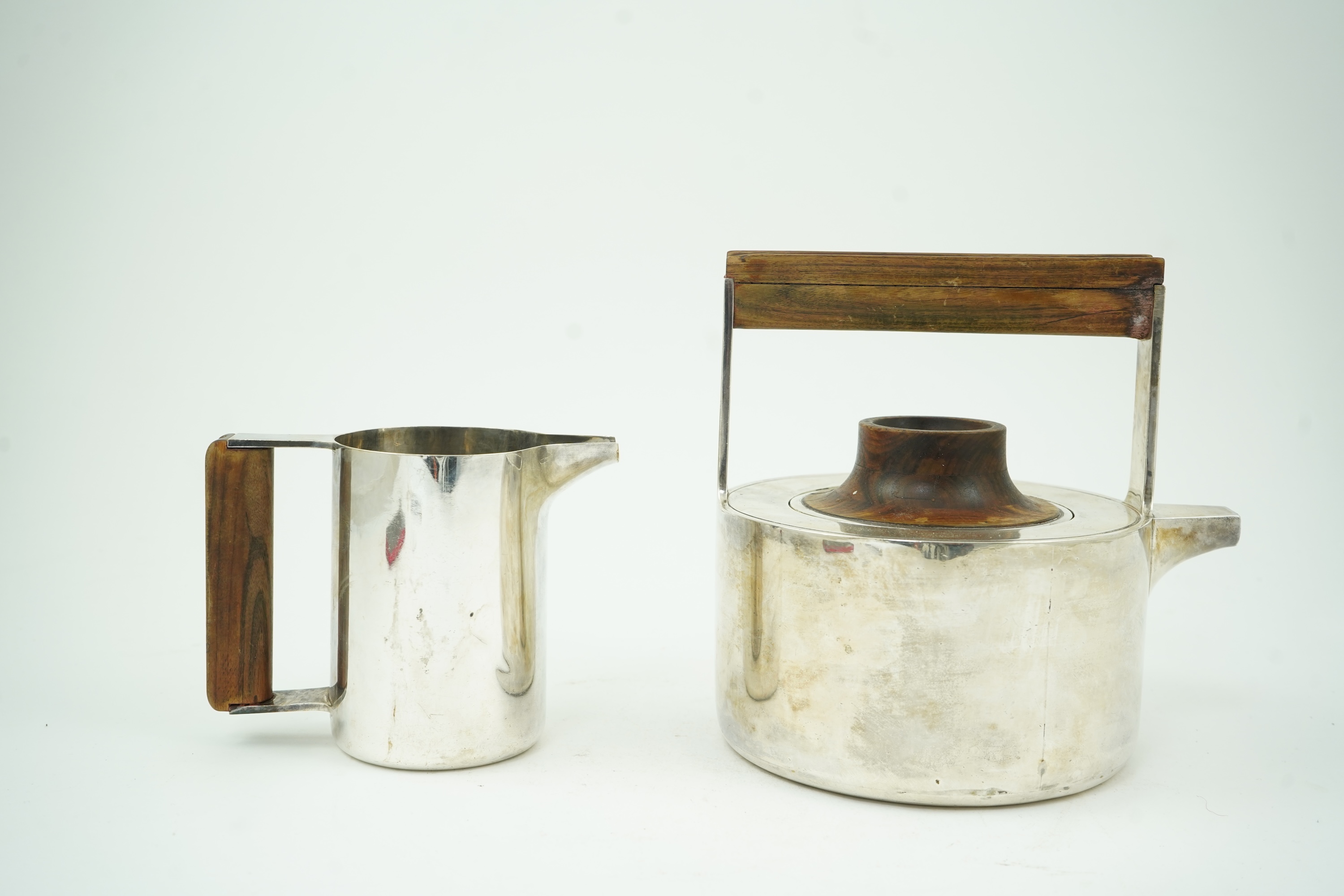 Roy Ridsdale (1942-2020): A silver tea kettle and matching cream jug